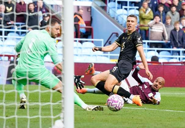 Birmingham, England, 5th October 2025. Donyell Malen of Aston Villa (R) scores the opening goal during the Aston Villa vs Burnley Premier League match at Villa Park, Birmingham. Picture credit should read: Andrew Yates Sportimage EDITORIAL USE ONLY. No use with unauthorised audio, video, data, fixture lists, club league logos or live services. Online in-match use limited to 120 images, no video emulation. No use in betting, games or single club league player publications. SPI_011_VILLA_BURNLEY SPI-4198-0009
