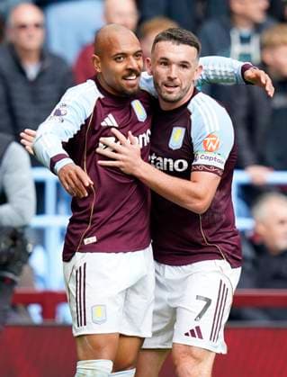Birmingham, England, 5th October 2025. Donyell Malen of Aston Villa (L) celebrates after scoring the opening goal with John McGinn of Aston Villa during the Aston Villa vs Burnley Premier League match at Villa Park, Birmingham. Picture credit should read: Andrew Yates Sportimage EDITORIAL USE ONLY. No use with unauthorised audio, video, data, fixture lists, club league logos or live services. Online in-match use limited to 120 images, no video emulation. No use in betting, games or single club league player publications. SPI_013_VILLA_BURNLEY SPI-4198-0013
