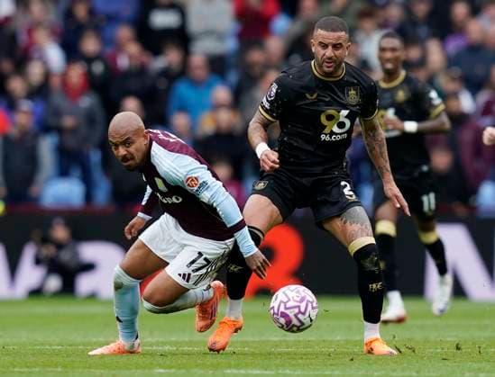 Birmingham, England, 5th October 2025. Donyell Malen of Aston Villa (L) is challenged by Kyle Walker of Burnley during the Aston Villa vs Burnley Premier League match at Villa Park, Birmingham. Picture credit should read: Andrew Yates Sportimage EDITORIAL USE ONLY. No use with unauthorised audio, video, data, fixture lists, club league logos or live services. Online in-match use limited to 120 images, no video emulation. No use in betting, games or single club league player publications. SPI_018_AY_VILLA_BURNLEY SPI-4198-0017