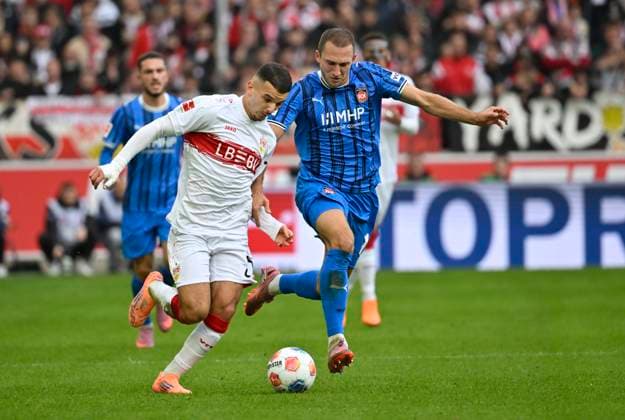 Zweikampf, Aktion Badredine Bouanani VfB Stuttgart (27) gegen Jonas Foehrenbach 1. FC Heidenheim 1846 FCH (19) VfB Stuttgart vs 1. FC Heidenheim FCH 05.10.2025 DFL REGULATIONS PROHIBIT ANY USE OF PHOTOGRAPHS AS IMAGE SEQUENCES AND OR QUASI-VIDEO VfB Stuttgart vs 1. FC Heidenheim FCH