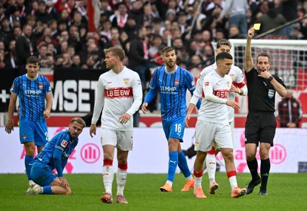 nach Zweikampf, Aktion Foul Bilal El Khannouss VfB Stuttgart (11) gegen Niklas Dorsch 1. FC Heidenheim 1846 FCH (30) zeigt Schiedsrichter Referee Tobias Stieler gelbe Karte gelb Verwarnung VfB Stuttgart vs 1. FC Heidenheim FCH 05.10.2025 DFL REGULATIONS PROHIBIT ANY USE OF PHOTOGRAPHS AS IMAGE SEQUENCES AND OR QUASI-VIDEO VfB Stuttgart vs 1. FC Heidenheim FCH