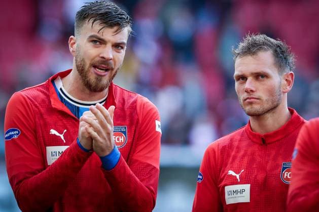 Julian Niehues 16 (1FC Heidenheim 1846) und Tim Siersleben 4 (1FC Heidenheim 1846) enttaeuscht bei den Fans, VfB Stuttgart vs. 1. FC Heidenheim 1846, DFL, Bundesliga, Saison 2025 2026, MHP Arena, Hinrunde, 6. Spieltag, 05.10.2025 DFB regulations prohibit any use of photographs as image sequences and or quasi-video Stuttgart Baden-Wuerttemberg Deutschland