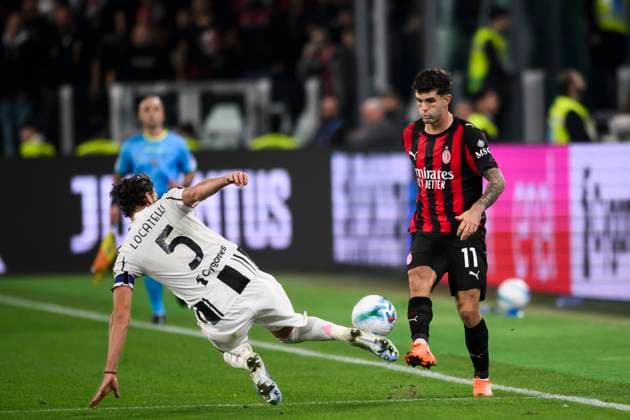 Juventus FC v AC Milan - Serie A Christian Pulisic of AC Milan is tackled by Manuel Locatelli of Juventus FC during the Serie A football match between Juventus FC and AC Milan. Turin Italy Copyright: xNicolòxCampox