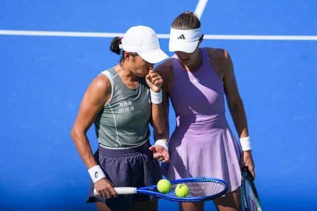 WUHAN, CHINA - OCTOBER 06: Zhang Shuai of China and Kristina Mladenovic of France react in the Women s Doubles Round of 32 match against Shuko Aoyama of Japan and Cristina Bucsa of Spain on day 3 of 2025 Wuhan Open at Optics Valley International Tennis Center on October 6, 2025 in Wuhan, Hubei Province of China.  Copyright: xVCGx 111595399820