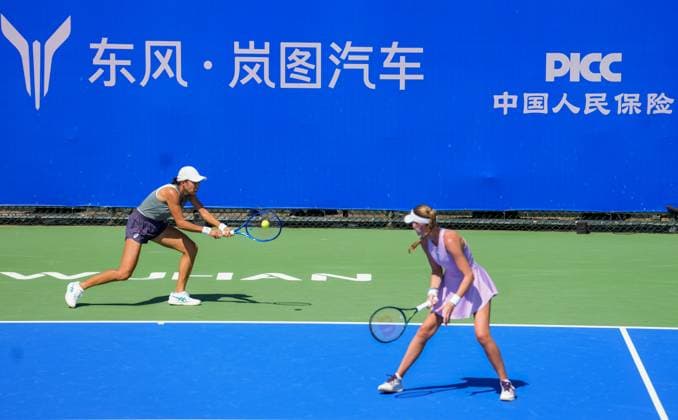 WUHAN, CHINA - OCTOBER 06: Zhang Shuai of China and Kristina Mladenovic of France return a shot in the Women s Doubles Round of 32 match against Shuko Aoyama of Japan and Cristina Bucsa of Spain on day 3 of 2025 Wuhan Open at Optics Valley International Tennis Center on October 6, 2025 in Wuhan, Hubei Province of China.  Copyright: xVCGx 111595399803