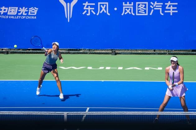 WUHAN, CHINA - OCTOBER 06: Zhang Shuai of China and Kristina Mladenovic of France return a shot in the Women s Doubles Round of 32 match against Shuko Aoyama of Japan and Cristina Bucsa of Spain on day 3 of 2025 Wuhan Open at Optics Valley International Tennis Center on October 6, 2025 in Wuhan, Hubei Province of China.  Copyright: xVCGx 111595399805