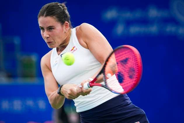 WUHAN, CHINA - OCTOBER 07: Emma Navarro of the United States returns a shot in the Women s Singles Round of 64 match against Zhang Shuai of China on day 4 of 2025 Wuhan Open at Optics Valley International Tennis Center on October 7, 2025 in Wuhan, Hubei Province of China.  Copyright: xVCGx 111595682175
