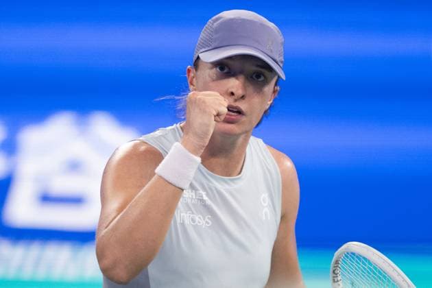 (251007) -- WUHAN, Oct. 7, 2025 -- Iga Swiatek of Poland celebrates during the women s singles round of 32 match against Marie Bouzkova of the Czech Republic at the 2025 Wuhan Open tennis tournament in Wuhan, central China s Hubei Province, Oct. 7, 2025. ) (SP)CHINA-WUHAN-TENNIS-WUHAN OPEN-WOMEN S SINGLES (CN) XiaoxYijiu 