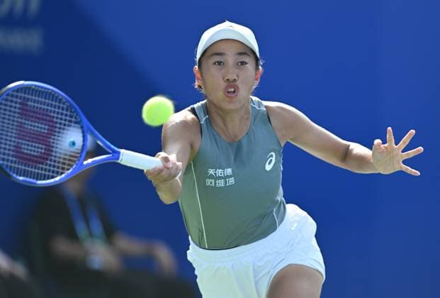 (251008) -- WUHAN, Oct. 8, 2025 -- Zhang Shuai of China returns a hit during the women s singles round of 32 match against Sorana Cirstea of Romania at the 2025 Wuhan Open tennis tournament in Wuhan, central China s Hubei Province, Oct. 8, 2025. ) (SP)CHINA-WUHAN-TENNIS-WUHAN OPEN-WOMEN S SINGLES (CN) ChengxMin 
