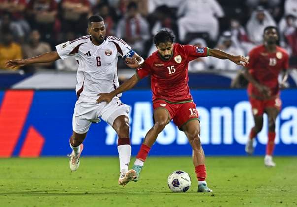 QATAR V OMAN-2026 FIFA World Cup, WM, Weltmeisterschaft, Fussball ASIAN QUALIFIER PLAYOFFS Abdel Aziz Hatim (L) of Qatar and Nasser Sultan Al-Rawahi of Oman in action during the FIFA World Cup 2026 AFC Asian qualifiers playoffs group A match between Qatar v Oman at Jassim Bin Hamad Stadium in Doha, Qatar, on October 8, 2025. DOHA Qatar Copyright: xNOUSHADx