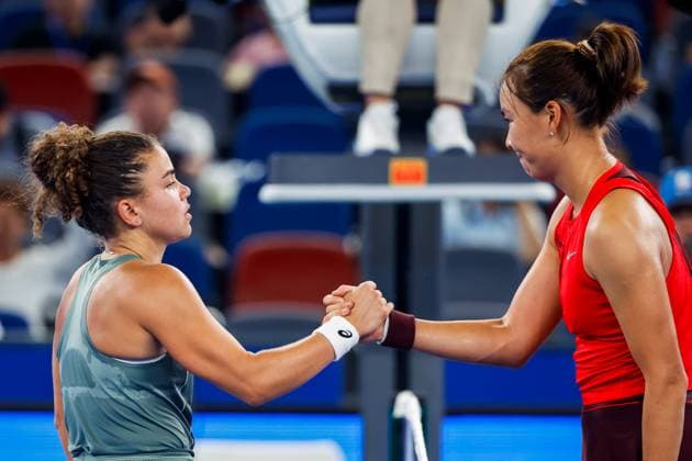WUHAN, CHINA - OCTOBER 08: Jasmine Paolini of Italy high-fives Yuan Yue of China after the Women s Singles Round of 32 match on day 5 of 2025 Wuhan Open at Optics Valley International Tennis Center on October 8, 2025 in Wuhan, Hubei Province of China.  Copyright: xVCGx 111595917811