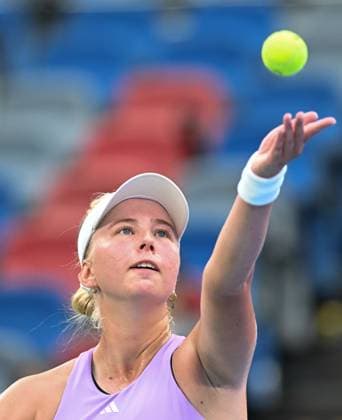 (251009) -- WUHAN, Oct. 9, 2025 -- Clara Tauson serves during the women s singles round of 16 match between Jasmine Paolini of Italy and Clara Tauson of Denmark at the 2025 Wuhan Open tennis tournament in Wuhan, central China s Hubei Province, Oct. 9, 2025. ) (SP)CHINA-WUHAN-TENNIS-WUHAN OPEN-WOMEN S SINGLES (CN) ChengxMin 