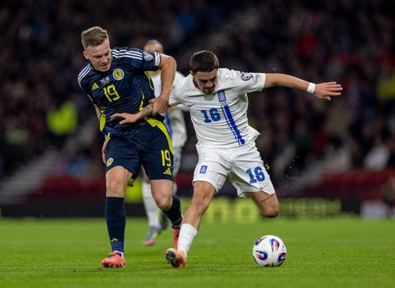 9th October 2025; Hampden Park, Glasgow, Scotland; World Cup Qualifiers International Football, Scotland versus Greece; Lewis Ferguson of Scotland challenges Christos Zafeiris of Greece  VagelisxGeorgariou