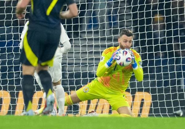 Scotland goalkeeper Angus Gunn under pressure from Christos Tzolis of Greece after a poor pass from Aaron Hickey of Scotland. Scotland v Greece, FIFA 2026 World Cup Qualifying, Group C, Football, Hampden Park, Glasgow, Scotland, UK - 09 Oct 2025Glasgow Hampden Park United Kingdom EDITORIAL USE ONLY No use with unauthorised audio, video, data, fixture lists, club league logos or live services. Online in-match use limited to 120 images, no video emulation. No use in betting, games or single club league player publications. Copyright: xStuartxWallace Shutterstockx 15522896an