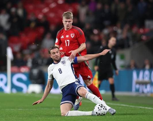 London, England, 9th October 2025. Jordan James of Wales tackles Jordan Henderson of England during the England vs Wales International Friendly, Länderspiel, Nationalmannschaft match at Wembley Stadium, London. Picture credit should read: Paul Terry Sportimage EDITORIAL USE ONLY. No use with unauthorised audio, video, data, fixture lists, club league logos or live services. Online in-match use limited to 120 images, no video emulation. No use in betting, games or single club league player publications. SPI_032_PT_Eng_Wal SPI-4207-0078