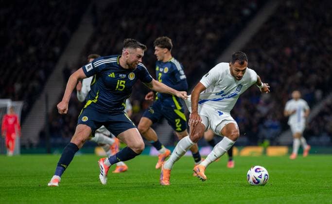 9th October 2025; Hampden Park, Glasgow, Scotland; World Cup Qualifiers International Football, Scotland versus Greece; John Souttar of Scotland grabs hold of Vangelis Pavlidis of Greece  VagelisxGeorgariou