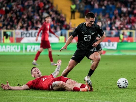 October 9, 2025, Chorzow, Poland: Polish football player Kacper Kozlowski and Ryan Thomas of New Zealand seen in action during the friendly match between Poland and New Zealand at Silesia Stadium. Final score; Poland wins 1:0. Chorzow Poland - ZUMAs197 20251009_aaa_s197_397 Copyright: xDominikaxZarzyckax