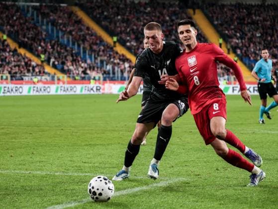 October 9, 2025, Chorzow, Poland: Polish football player Bartosz Kapustka and Finn Surman of New Zealand seen in action during the friendly match between Poland and New Zealand at Silesia Stadium. Final score; Poland wins 1:0. Chorzow Poland - ZUMAs197 20251009_aaa_s197_405 Copyright: xDominikaxZarzyckax