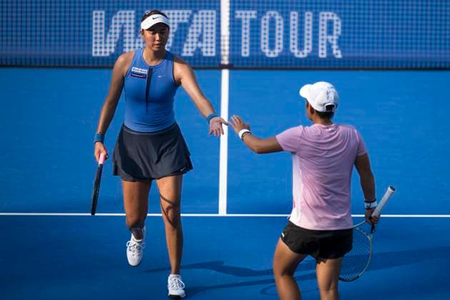 (251010) -- WUHAN, Oct. 10, 2025 -- Chan Hao-Ching (L) Jiang Xinyu celebrate during the women s doubles quarterfinal between Chan Hao-Ching (Chinese Taipei) Jiang Xinyu (China) and Storm Hunter (Australia) Katerina Siniakova (the Czech Republic) at the 2025 Wuhan Open tennis tournament in Wuhan, central China s Hubei Province, Oct. 10, 2025. ) (SP)CHINA-WUHAN-TENNIS-WUHAN OPEN-WOMEN S DOUBLES-QUARTERFINAL (CN) WuxZhizun 