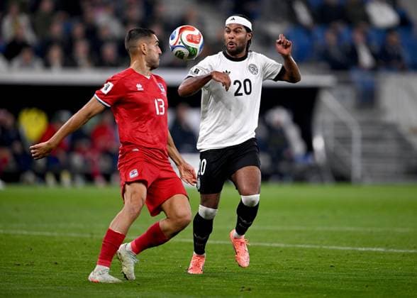 Fussball International Qualifikation WM 2026 in Sinsheim Gruppe A 3. Spieltag Deutschland - Luxenburg 10.10.2025 Dirk Carlson (li, Luxenburg) gegen Serge Gnabry (re, Deutschland)