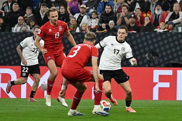 10.10.2025, xsltx, Fussball WM-Qualifikation 2026, Deutschland - Luxemburg v.l. Mathias Olesen (Luxemburg) Enes Mahmutovic (Luxemburg) Florian Wirtz (Deutsche Fussball Nationalmannschaft DFB) Zweikampf, Aktion, action, battle for the ball (DFL DFB REGULATIONS PROHIBIT ANY USE OF PHOTOGRAPHS as IMAGE SEQUENCES and or QUASI-VIDEO) Sinsheim