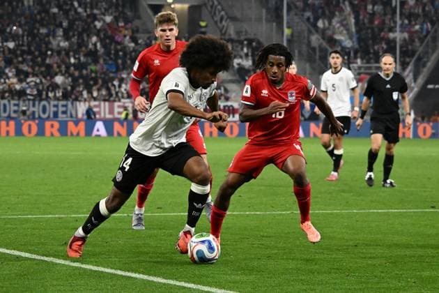 10.10.2025, xsltx, Fussball WM-Qualifikation 2026, Deutschland - Luxemburg v.l. Karim Adeyemi (Deutsche Fussball Nationalmannschaft DFB) Leandro Barreiro (Luxemburg) Zweikampf, Aktion, action, battle for the ball (DFL DFB REGULATIONS PROHIBIT ANY USE OF PHOTOGRAPHS as IMAGE SEQUENCES and or QUASI-VIDEO) Sinsheim