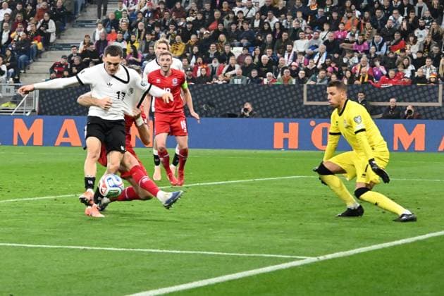 10.10.2025, xsltx, Fussball WM-Qualifikation 2026, Deutschland - Luxemburg v.l. Enes Mahmutovic (Luxemburg) Florian Wirtz (Deutsche Fussball Nationalmannschaft DFB) Anthony Moris (Luxemburg) (DFL DFB REGULATIONS PROHIBIT ANY USE OF PHOTOGRAPHS as IMAGE SEQUENCES and or QUASI-VIDEO) Sinsheim