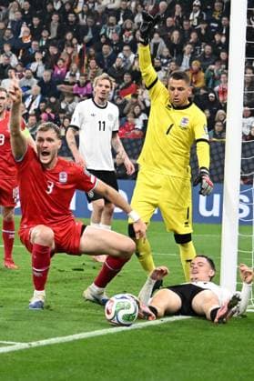 10.10.2025, xsltx, Fussball WM-Qualifikation 2026, Deutschland - Luxemburg v.l. Enes Mahmutovic (Luxemburg) Florian Wirtz (Deutsche Fussball Nationalmannschaft DFB) Anthony Moris (Luxemburg) (DFL DFB REGULATIONS PROHIBIT ANY USE OF PHOTOGRAPHS as IMAGE SEQUENCES and or QUASI-VIDEO) Sinsheim