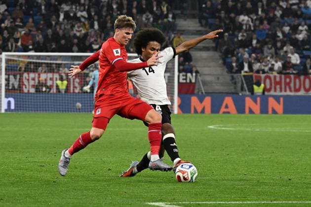 10.10.2025, xsltx, Fussball WM-Qualifikation 2026, Deutschland - Luxemburg v.l. Karim Adeyemi (Deutsche Fussball Nationalmannschaft DFB) Florian Bohnert (Luxemburg) Zweikampf, Aktion, action, battle for the ball (DFL DFB REGULATIONS PROHIBIT ANY USE OF PHOTOGRAPHS as IMAGE SEQUENCES and or QUASI-VIDEO) Sinsheim