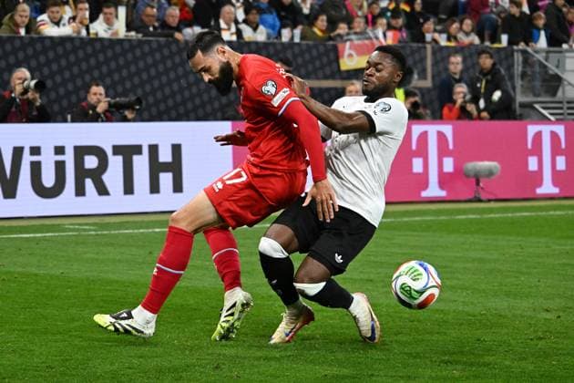 10.10.2025, xsltx, Fussball WM-Qualifikation 2026, Deutschland - Luxemburg v.l. Vahid Selimovic (Luxemburg) Ridle Baku (Deutsche Fussball Nationalmannschaft DFB) Zweikampf, Aktion, action, battle for the ball (DFL DFB REGULATIONS PROHIBIT ANY USE OF PHOTOGRAPHS as IMAGE SEQUENCES and or QUASI-VIDEO) Sinsheim