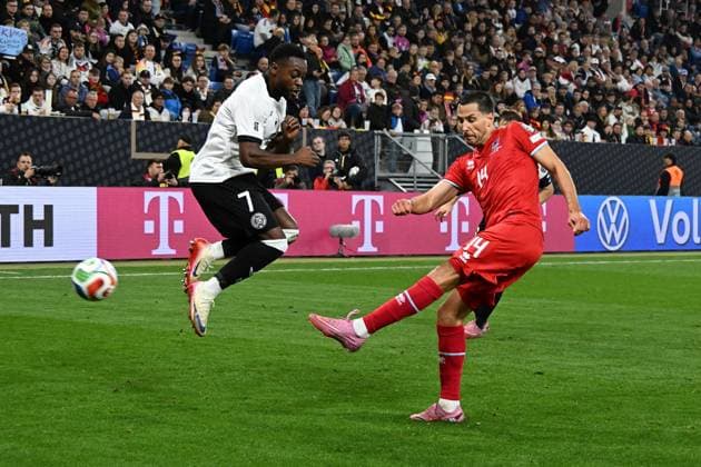 10.10.2025, xsltx, Fussball WM-Qualifikation 2026, Deutschland - Luxemburg v.l. Ridle Baku (Deutsche Fussball Nationalmannschaft DFB) Eric Veiga (Luxemburg) Zweikampf, Aktion, action, battle for the ball (DFL DFB REGULATIONS PROHIBIT ANY USE OF PHOTOGRAPHS as IMAGE SEQUENCES and or QUASI-VIDEO) Sinsheim