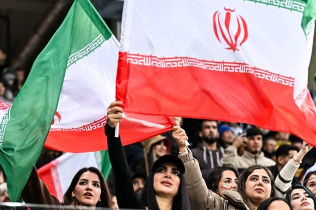 Russia Soccer Friendly Russia - Iran 9023798 10.10.2025 Iran s fans cheer with national flags during the friendly soccer match between Russia and Iran, in Volgograd, Russia. Sergey Bobylev Sputnik Volgograd Russia  Copyright: xSergeyxBobylevx