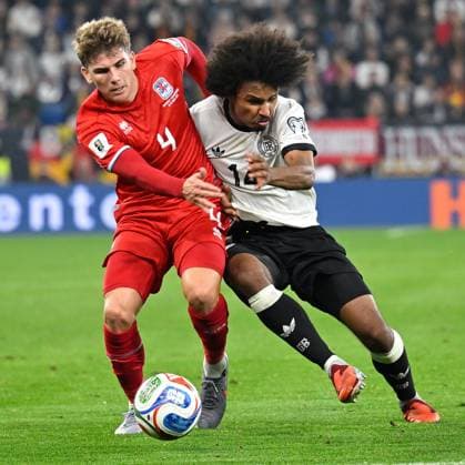 (251011) -- SINSHEIM, Oct. 11, 2025 -- Karim Adeyemi (R) of Germany vies with Florian Bohnert of Luxembourg during the 2026 World Cup European Qualifiers football match between Germany and Luxembourg in Sinsheim, Germany, Oct. 10, 2025. (Photo by Xinhua) (SP)GERMANY-SINSHEIM-FOOTBALL FIFA World Cup, WM, Weltmeisterschaft, Fussball QUALIFIERS-GERMANY VS LUXEMBOURG UlrichxHufnagel 
