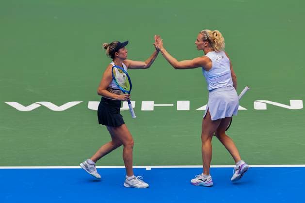 WUHAN, CHINA - OCTOBER 11: Storm Hunter of Australia and Katerina Siniakova of the Czech Republic react in the Women s Doubles Semifinal match against Olivia Nicholls of Great Britain and Tereza Mihalikova of Slovakia on day 8 of 2025 Wuhan Open at Optics Valley International Tennis Center on October 11, 2025 in Wuhan, Hubei Province of China.  Copyright: xVCGx 111596554011
