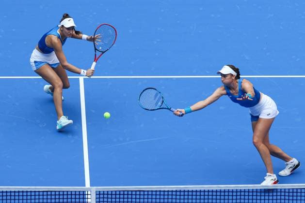 WUHAN, CHINA - OCTOBER 11: Olivia Nicholls of Great Britain and Tereza Mihalikova of Slovakia return a shot in the Women s Doubles Semifinal match against Storm Hunter of Australia and Katerina Siniakova of the Czech Republic on day 8 of 2025 Wuhan Open at Optics Valley International Tennis Center on October 11, 2025 in Wuhan, Hubei Province of China.  Copyright: xVCGx 111596553922