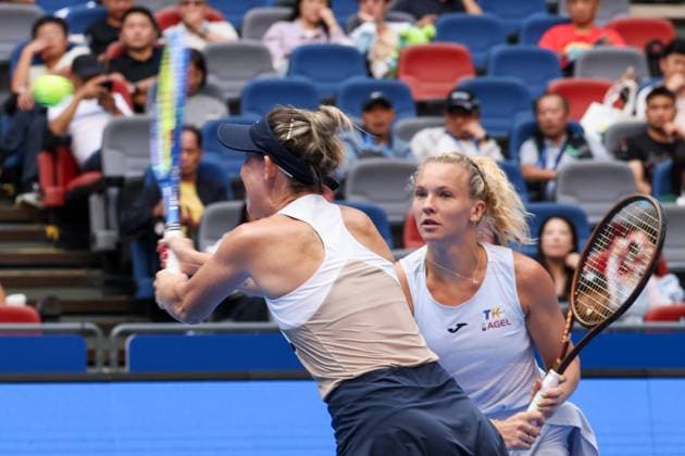 WUHAN, CHINA - OCTOBER 11: Storm Hunter of Australia and Katerina Siniakova of the Czech Republic return a shot in the Women s Doubles Semifinal match against Olivia Nicholls of Great Britain and Tereza Mihalikova of Slovakia on day 8 of 2025 Wuhan Open at Optics Valley International Tennis Center on October 11, 2025 in Wuhan, Hubei Province of China.  Copyright: xVCGx 111596553885