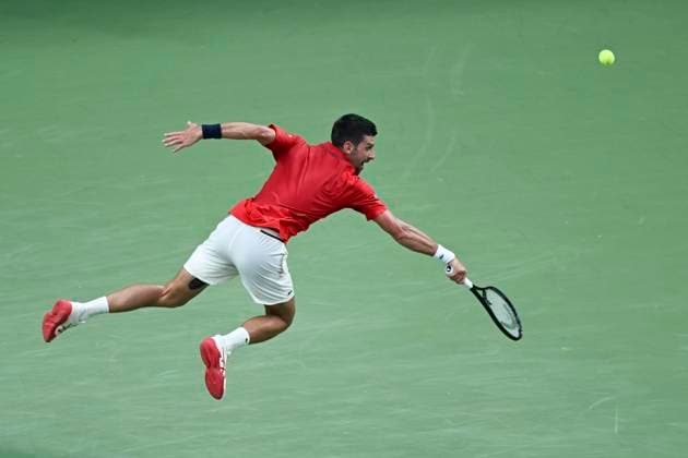 (251011) -- SHANGHAI, Oct. 11, 2025 -- Novak Djokovic hits a return during the men s singles semifinal between Novak Djokovic of Serbia and Valentin Vacherot of Monaco at the ATP, Tennis Herren World Tour Shanghai Masters tennis tournament in Shanghai, east China, Oct. 11, 2025. ) (SP)CHINA-SHANGHAI-TENNIS-ATP TOUR-SHANGHAI MASTERS-MEN S SINGLES (CN) ChenxHaoming 
