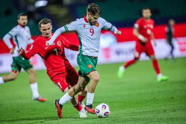 Football - World Cup Qualifiers - Group Stage - Group E - Bulgaria - Turkey - 04.09.2025 Kristiyan Stoyanov of Bulgaria and Kerem AktürkoÄülu of Turkey in action during World Cup Qualifiers group stage match between Bulgaria and Turkey Bulgaria Copyright: xYulianxTodorovx