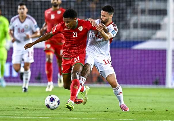 UNITED ARAB EMIRATES v OMAN-2026 FIFA World Cup, WM, Weltmeisterschaft, Fussball ASIAN QUALIFIER PLAYOFFS Marcus Vinicius (R) of United Arab Emirates and Abdul Rahman Al Mushaifri of Oman in action during the FIFA World Cup 2026 AFC Asian qualifiers playoffs group A match between United Arab Emirates and Oman at Jassim Bin Hamad Stadium in Doha, Qatar, on October 11, 2025. DOHA Qatar Copyright: xNOUSHADx