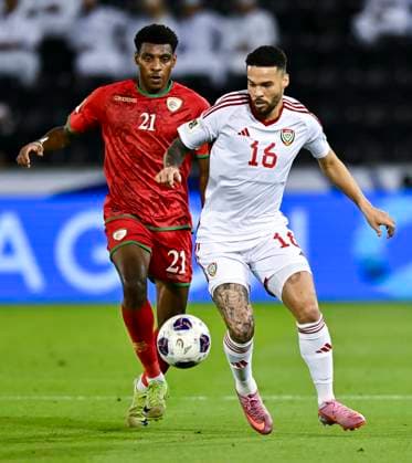UNITED ARAB EMIRATES v OMAN-2026 FIFA World Cup, WM, Weltmeisterschaft, Fussball ASIAN QUALIFIER PLAYOFFS Marcus Vinicius (R) of United Arab Emirates and Abdul Rahman Al Mushaifri of Oman in action during the FIFA World Cup 2026 AFC Asian qualifiers playoffs group A match between United Arab Emirates and Oman at Jassim Bin Hamad Stadium in Doha, Qatar, on October 11, 2025. DOHA Qatar Copyright: xNOUSHADx