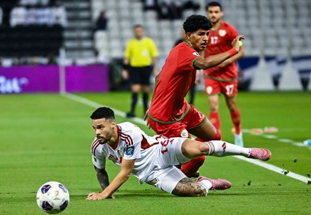 UNITED ARAB EMIRATES v OMAN-2026 FIFA World Cup, WM, Weltmeisterschaft, Fussball ASIAN QUALIFIER PLAYOFFS Marcus Vinicius (L) of United Arab Emirates and Issam Alsabhi of Oman in action during the FIFA World Cup 2026 AFC Asian qualifiers playoffs group A match between United Arab Emirates and Oman at Jassim Bin Hamad Stadium in Doha, Qatar, on October 11, 2025. DOHA Qatar Copyright: xNOUSHADx