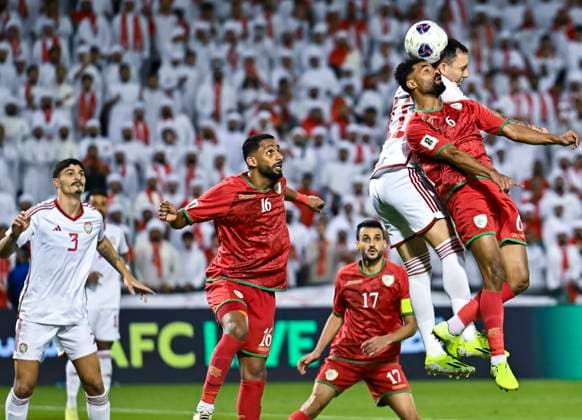 UNITED ARAB EMIRATES v OMAN-2026 FIFA World Cup, WM, Weltmeisterschaft, Fussball ASIAN QUALIFIER PLAYOFFS Caio Canedo Correa (2ndR) of United Arab Emirates and Nayef Faraj Bait Sabih of Oman in action during the FIFA World Cup 2026 AFC Asian qualifiers playoffs group A match between United Arab Emirates and Oman at Jassim Bin Hamad Stadium in Doha, Qatar, on October 11, 2025. DOHA Qatar Copyright: xNOUSHADx