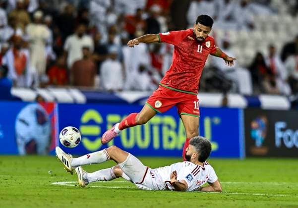 UNITED ARAB EMIRATES v OMAN-2026 FIFA World Cup, WM, Weltmeisterschaft, Fussball ASIAN QUALIFIER PLAYOFFS Yahia Nader (bottom) of United Arab Emirates and Muhsen Saleh Al Ghassaniof Oman in action during the FIFA World Cup 2026 AFC Asian qualifiers playoffs group A match between United Arab Emirates and Oman at Jassim Bin Hamad Stadium in Doha, Qatar, on October 11, 2025. DOHA Qatar Copyright: xNOUSHADx