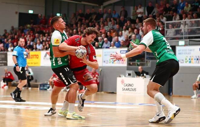 11.10.2025, xmohx, Handball 3.Liga Staffel Südwest, HG Saarlouis - TV Kirchzell v.l. Yves Kunkel (Saarlouis), Louis Hauptmann (Kirchzell), Philipp Kockler (Saarlouis) (DFL DFB REGULATIONS PROHIBIT ANY USE OF PHOTOGRAPHS as IMAGE SEQUENCES and or QUASI-VIDEO) Saarlouis