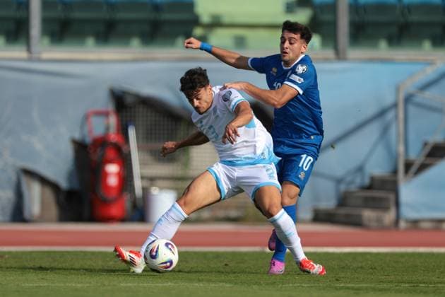 Serravalle, Italy, 12th October 2025. Alberto Riccardi of San Marino battles for possession with Loizos Loizou of Cyprus during the San Marino vs Cyprus FIFA World Cup, WM, Weltmeisterschaft, Fussball European Qualifying match at San Marino Stadium, Serravalle. Picture credit should read: Jonathan Moscrop Sportimage EDITORIAL USE ONLY. No use with unauthorised audio, video, data, fixture lists, club league logos or live services. Online in-match use limited to 120 images, no video emulation. No use in betting, games or single club league player publications. SPI_032_JM_SANMARINO_CYPRUS_EQ SPI-4191-0032