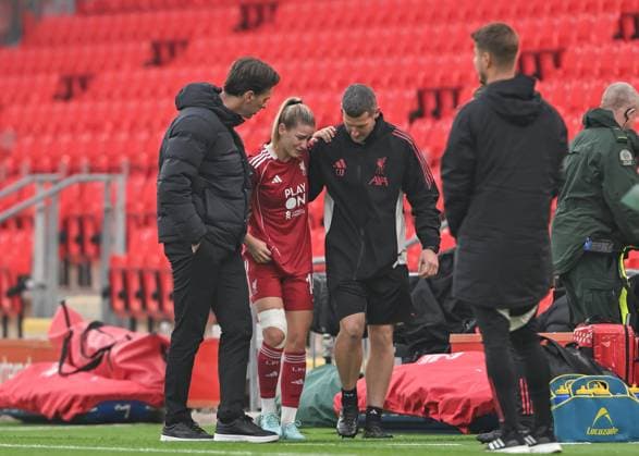 Liverpool, England, 12th October 2025. Marie Hobinger of Liverpool Women is comforted by Gareth Taylor manager of Liverpool Women as she leaves the pitch with an injury during the Liverpool FC Women vs Manchester City Women Barclays Women s Super League match at Anfield, Liverpool. Picture credit should read: Cody Froggatt Sportimage EDITORIAL USE ONLY. No use with unauthorised audio, video, data, fixture lists, club league logos or live services. Online in-match use limited to 120 images, no video emulation. No use in betting, games or single club league player publications. SPI_028_CF_LIVERPOOL_FC_WOMEN_V_MANCHESTER_CITY_WOMEN SPI-4213-0028