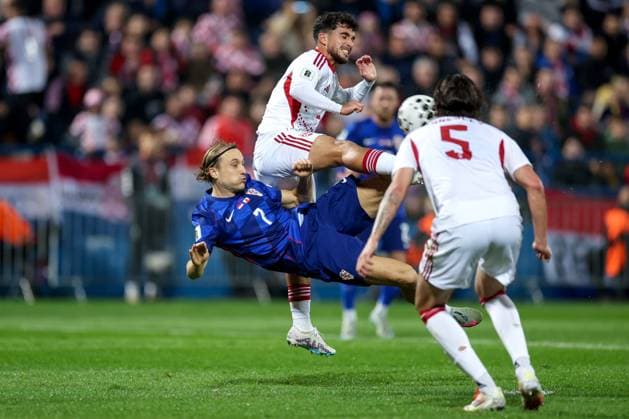Croatia v Gibraltar - FIFA World Cup, WM, Weltmeisterschaft, Fussball 2026 Qualifier VARAZDIN, CROATIA - OCTOBER 12: Lovro Majer of Croatia and Julian Valarino of Gibraltar battles for the ball during the FIFA World Cup 2026 qualifier match between Croatia and Gibraltar at Football Stadium Varteks on October 12, 2025 in Varazdin, Croatia.  MatijaxHabljak PIXSELL