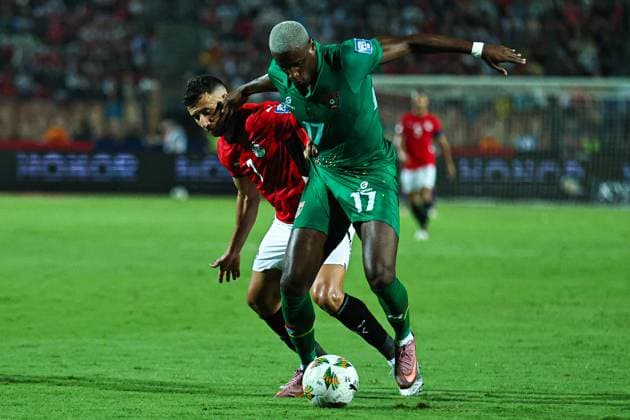 Egypt v Guinea-Bissau - FIFA World Cup, WM, Weltmeisterschaft, Fussball 2026 Qualifier Mahmoud Trezeguet (in red) challenges the Guinea-Bissau player during the 2026 FIFA World Cup qualifier between Egypt and Guinea-Bissau at Cairo International Stadium in Cairo, Egypt, on October 12, 2025. Cairo Egypt  Copyright: xAhmedxMosaadx originalFilename:mosad-notitle251012_np98P.jpg