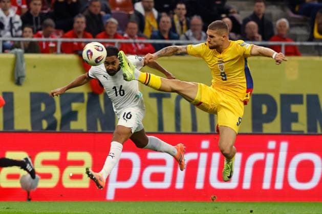 (251013) -- BUCHAREST, Oct. 13, 2025 -- Romania s Daniel Birligea (R) vies with Austria s Phillipp Mwene during the 2026 FIFA World Cup, WM, Weltmeisterschaft, Fussball group H qualifying football match between Romania and Austria at the Arena Nationala stadium in Bucharest, Romania, Oct. 12, 2025. (Photo by Xinhua) (SP)ROMANIA-BUCHAREST-FOOTBALL-WORLD CUP QUALIFIER-ROMANIA VS AUSTRIA CristianxCristel 