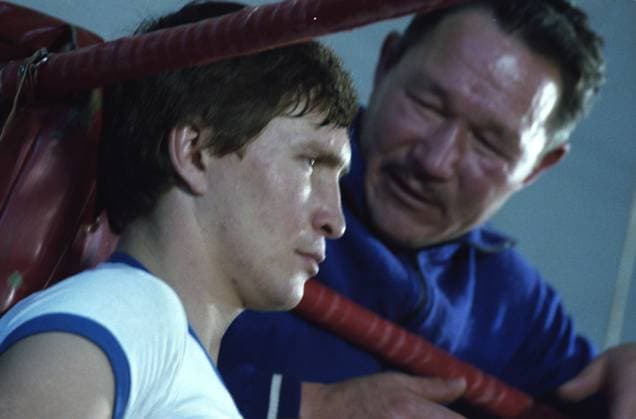 November, 1978. Cheboksary, Chuvash ASSR, USSR. World champion in the light welterweight, Soviet boxer Valery Lvov (front) listens to his coach Mikhail Stepanov in the ring corner during the interval between rounds of a boxing match at the boxing club of the Chuvash Republican Council of the Dynamo All-Union fitness and sports society. The exact date of the photograph is unknown. Vladimir Voitenko TASS  18903910
